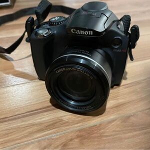 Canon power shot SX 40 HS camera with strap